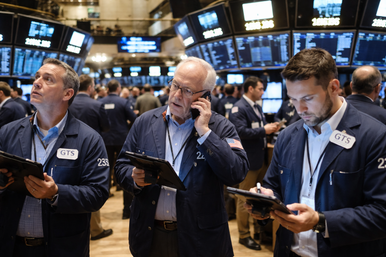 Dow hits record high as AI rally pauses, oil prices retreat